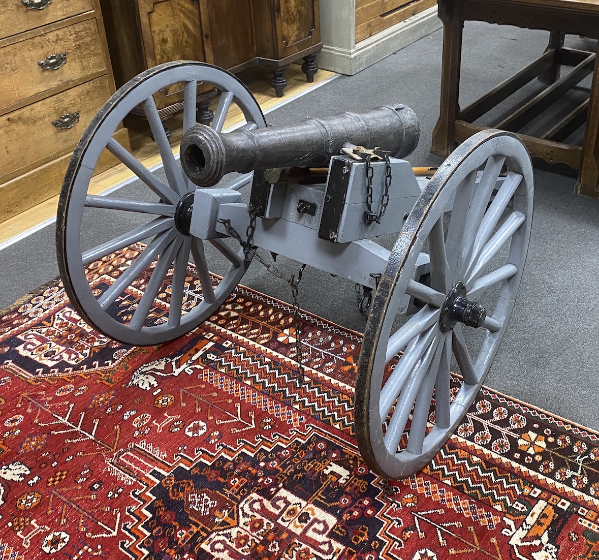 A model artillery cannon with composition barrel on painted spoke frame, length 193cm, height 84cm